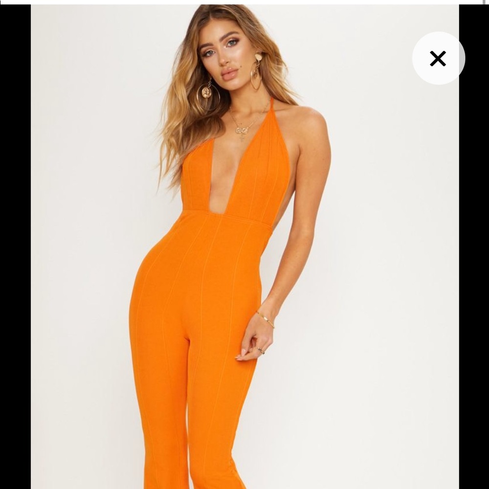 Orange bandage plunge flared jumpsuit
